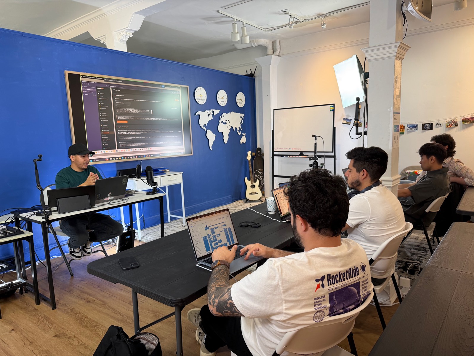 Presentation setup with screens and studio lighting
